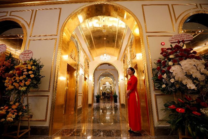 An employee in traditional dress is seen in the newly-inaugurated Dolce Hanoi Golden Lake luxury hotel, which features gold plated exteriors and interiors, after the government eased a nationwide lockdown following the global outbreak of the coronavirus disease (COVID-19), in Hanoi, Vietnam on July 2, 2020. (Photo by Reuters/Kham)